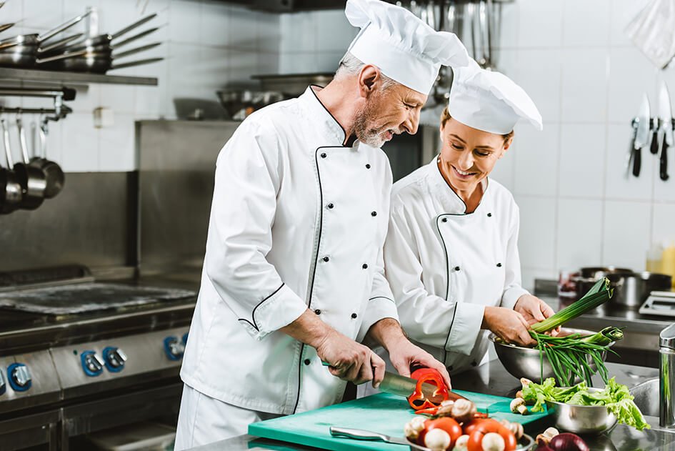smiling female and male chefs in uniform and hats 2022 03 31 23 15 55 utc.jpeg
