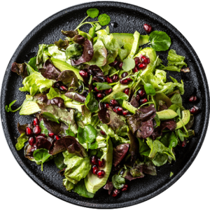 lettuce salad with pomegranate on black plate top 2022 02 02 03 55 51 utc isolated.png